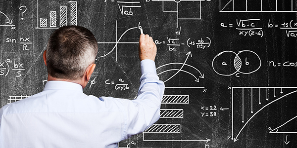 Man writing on a blackboard,600x300