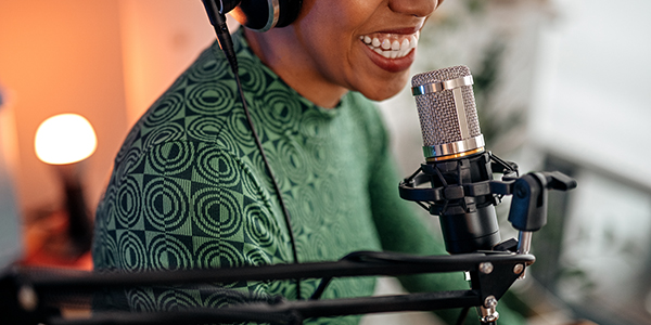 Woman speaking into a microphone