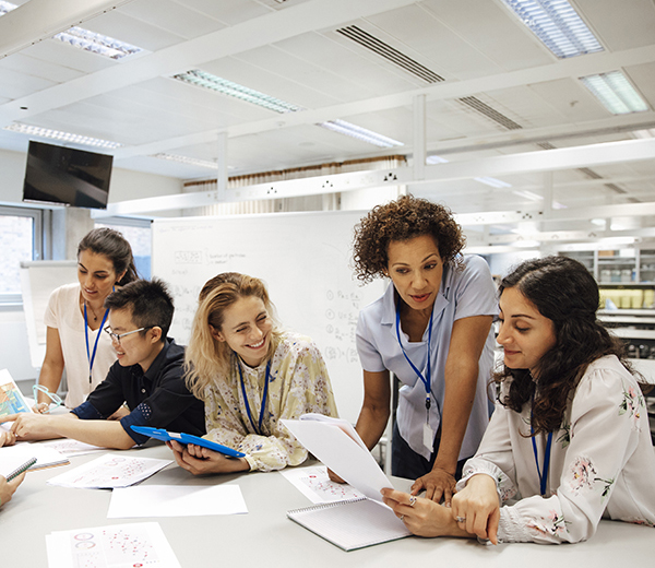 Group of students working with their lecturer