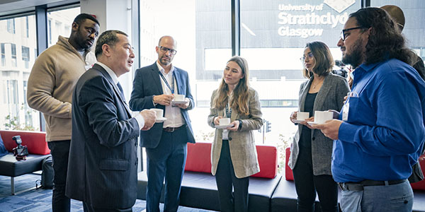 Dr Charles Huang with students and colleagues