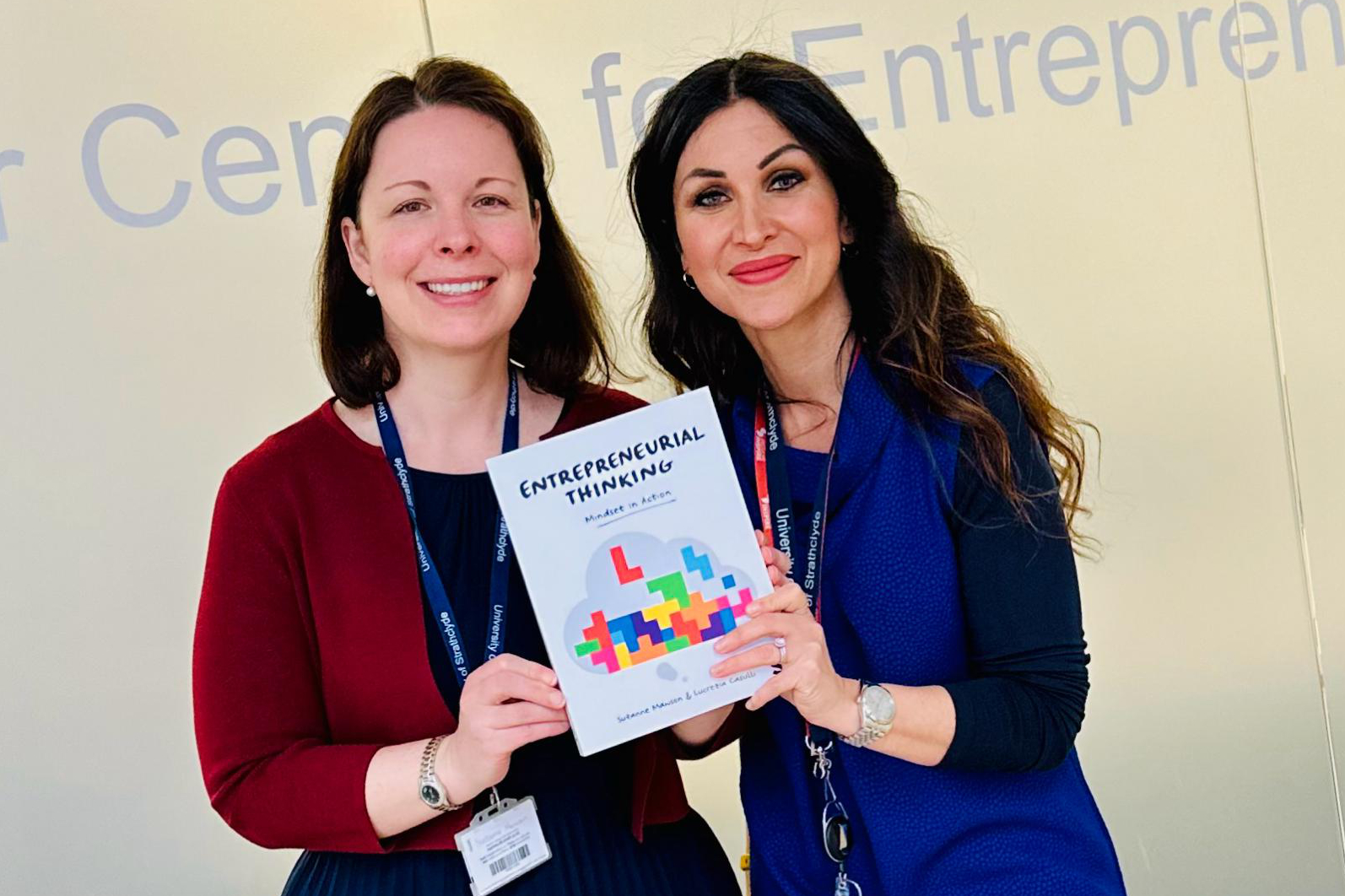 Strathclyde staff members Suzanne and Ezia with book