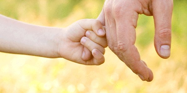 Child holding hand 600x300