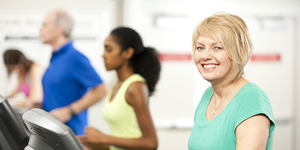 Gym members use the treadmills