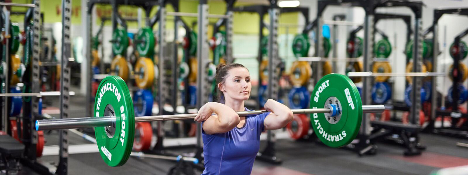 Strathclyde Sport member lifts barbell Strathclyde Sport member lifts barbell