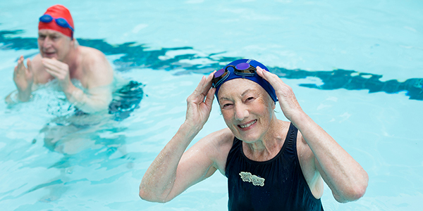 Swimmers enjoy the pool in the gym.
