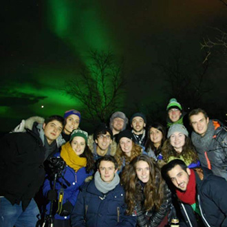 Students looking at the Aurora borealis