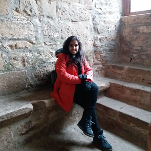 student sitting in historic building
