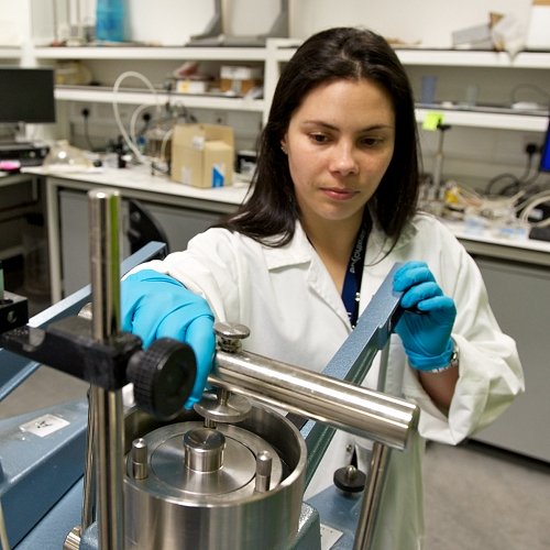 A woman uses civil engineering lab equipment