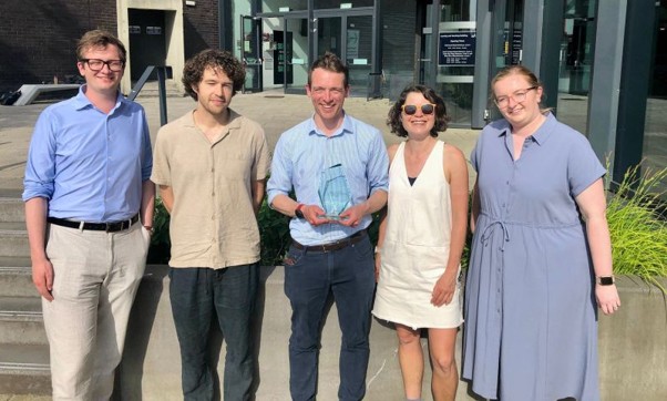 Photo of SISC team holding an award Photo of SISC team holding an award