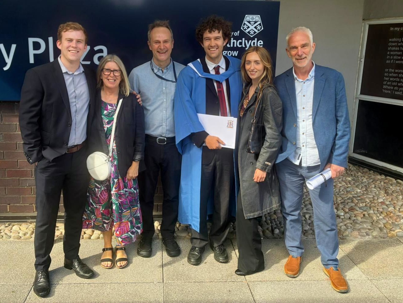Finlay Kerr and his family standing following his graduation