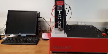 Front view of testometric tensile tester used to characterise the strength of single reinforcement fibres