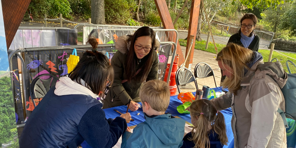 Children try Calligraphy at stand in Edinburgh Zoo