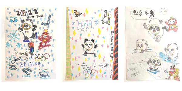 Three colourful posters depict panda mascots and winter sports