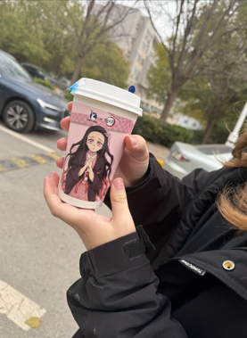 Photo of coffee cup featuring anime character Photo of coffee cup featuring anime character