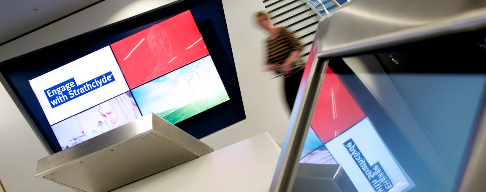 This image shows the TV display in the TIC building with the Engage with Strathclyde branding