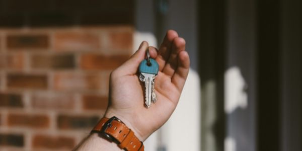 Person holding a key