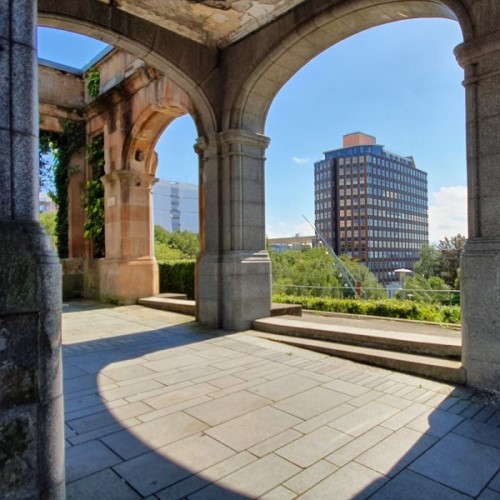 Rottenrow gardens in the sunlight with Livingstone Tower beyond