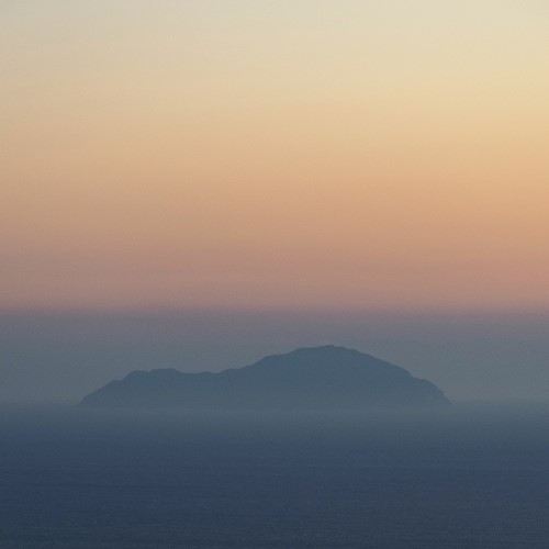 Silhouette of an island with sea and sky