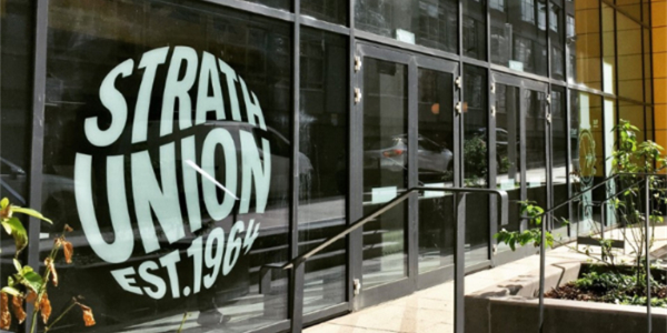 Front door of Strath Union showing logo on window