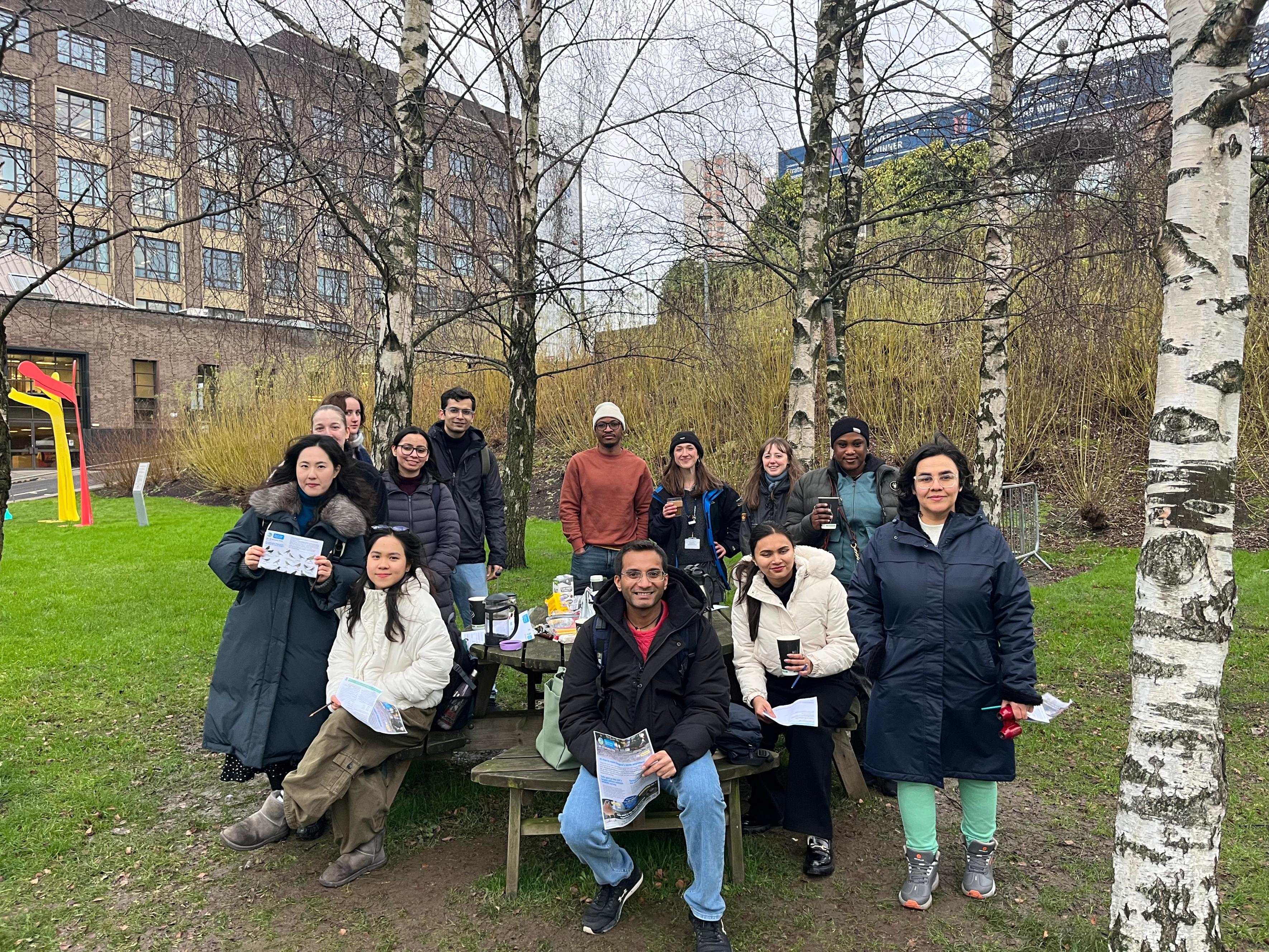 students next to tree