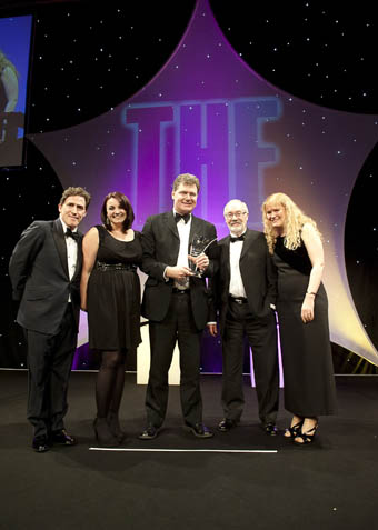 The HINS-light team collect the award at the ceremony in London