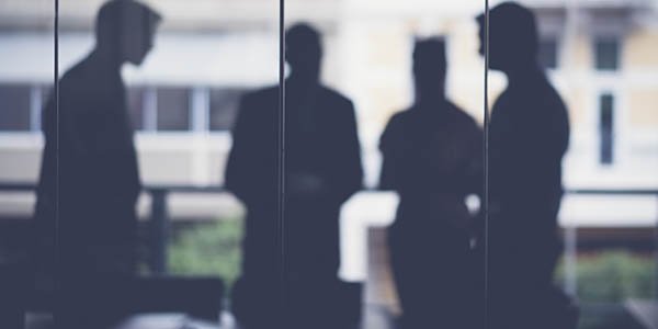 Silhouette of people in a meeting